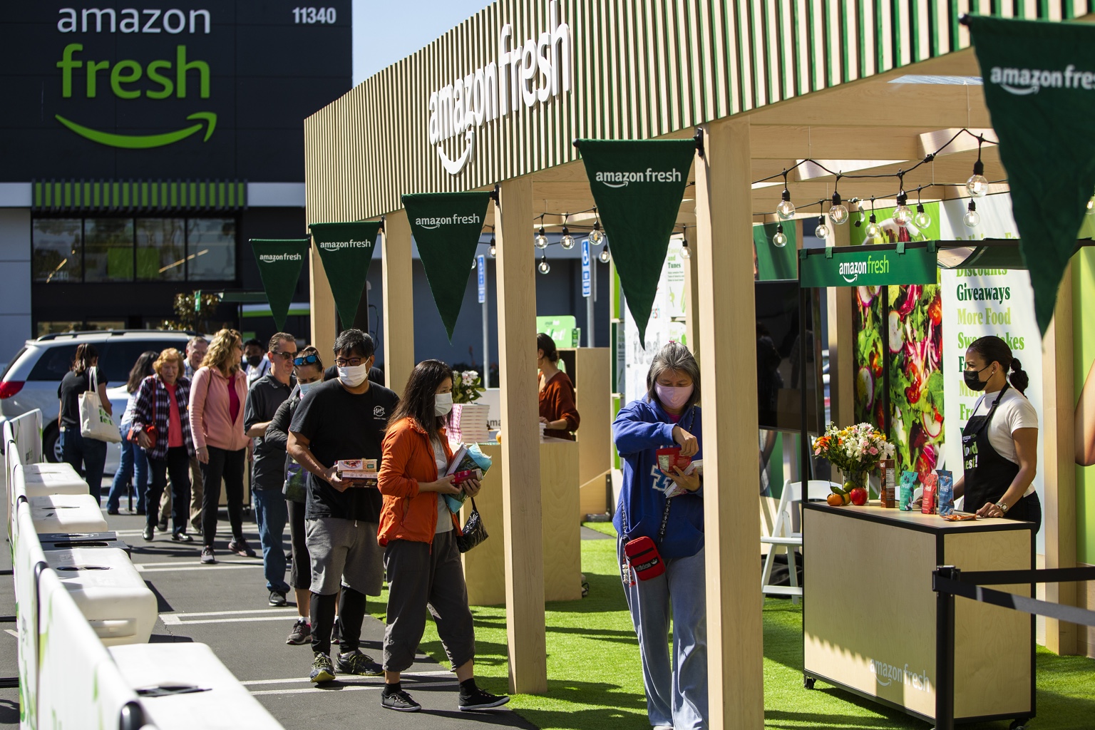 Guests and staffed timber bays at Amazon Fresh Food Fest.